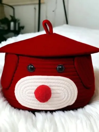 A bold red version of our teddy dog storage basket, perfect for adding a vibrant touch. It's great for storing items on a bed or shelf.