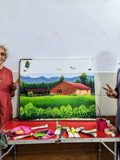 A proud moment for both student and mentor. Harinder ma'am and our instructor pose with her beautifully finished landscape painting.