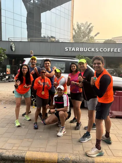 The tribe celebrating a successful run outside Starbucks. The reward is sweet when the work is hard.