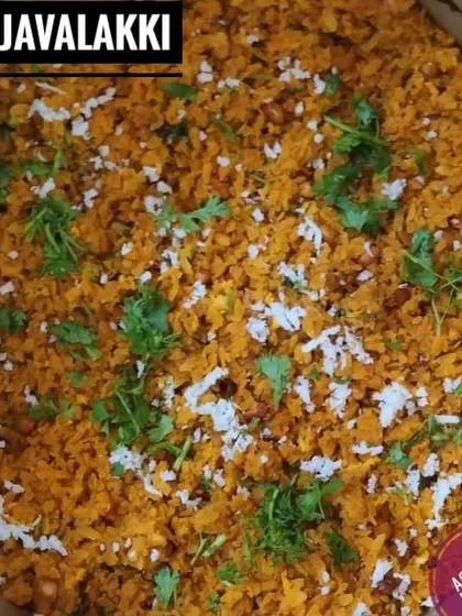 A closer look at my Gojjavalakki, a popular breakfast item. You can see the texture of the flattened rice, garnished with freshly grated coconut and coriander.