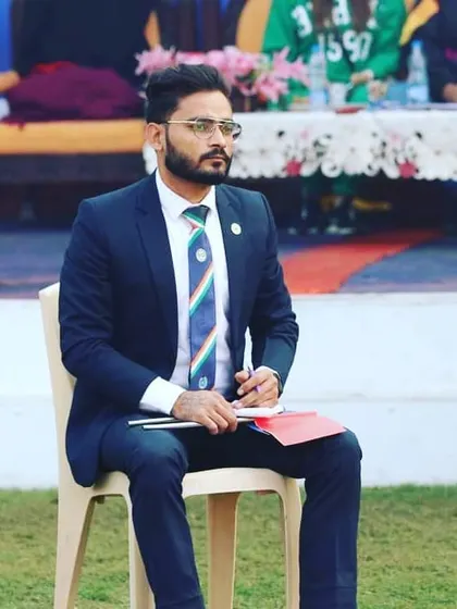 Taking notes during a competition. Officiating is a serious responsibility that I undertake to help maintain the integrity of Taekwondo championships.