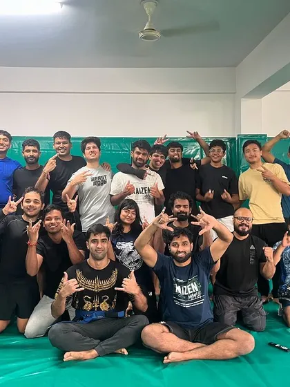 The whole team celebrating after our first promotion day. Special congratulations to our first blue belt, Rishab.