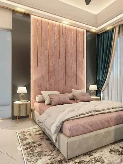 This wider shot of the pink-themed bedroom shows the balance of textures and colors. The soft headboard is framed by dark, sleek panels that lead to the ensuite, adding depth and a touch of modern sophistication.