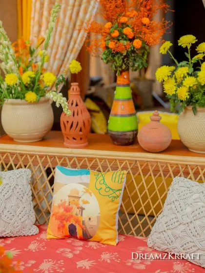 A close-up of the Haldi decor, showing the fusion of Indian and Lebanese elements with colorful cushions and pottery.