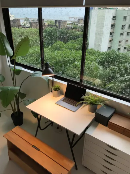 My studio on a bright day. The lush greenery outside the window brings a bit of nature indoors and makes it a refreshing place to create art.