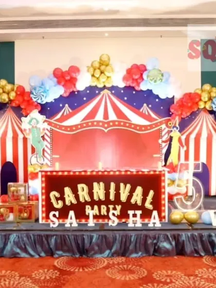 Step right up to this amazing Carnival themed birthday party. I created a full stage experience with a red and white striped circus tent backdrop, a Ferris wheel prop, a popcorn stand cutout, and vibrant marquee letters.