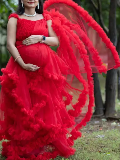 This red ruffle gown is a two-in-one convertible dress. The detachable ruffled skirt allows you to switch from a grand gown to a simpler dress in seconds.