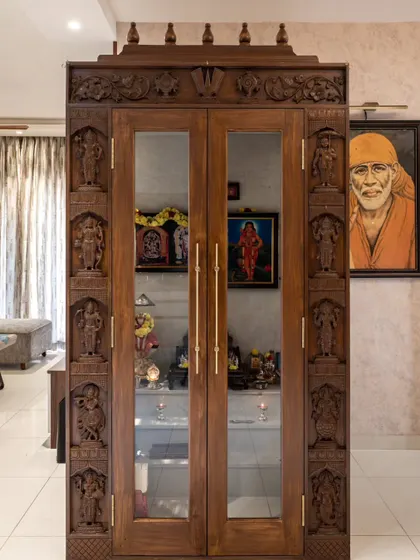 The final 'Muditā' puja unit, showcasing the incredible detail of the hand-carved teak wood frame.