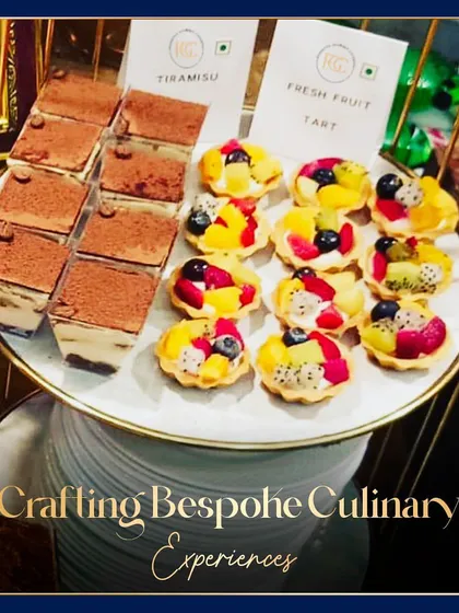 A platter of classic desserts: Tiramisu cups and fresh fruit tarts. This image highlights our ability to execute beloved international desserts with finesse and beautiful presentation.