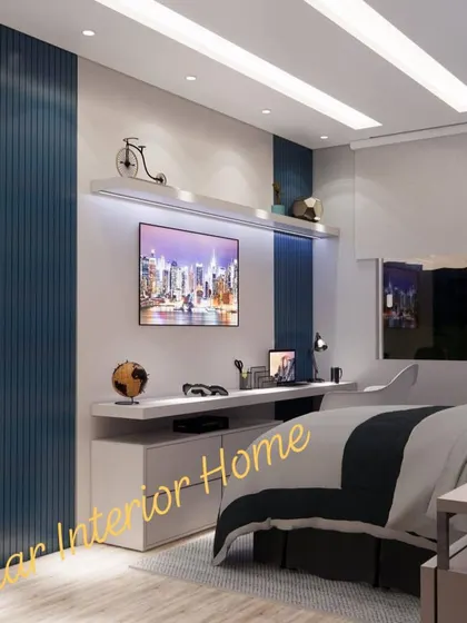 A wider view of the same room, showing the bed and the full functional wall.