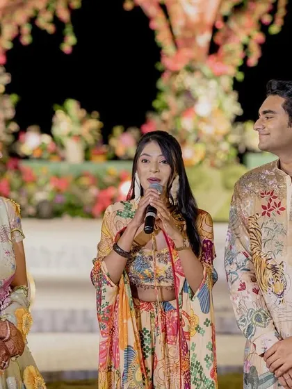 A candid moment showing the couple with a family member during a speech. This highlights how I also consider family outfits to ensure everyone looks great together.