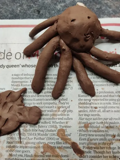 An eight legged octopus and a spiny axolotl, sculpted from clay. During our "Muddy Puddles" sessions, I learn so much from the children about their favorite animals and fun facts about nature.