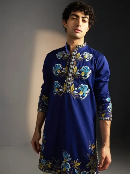 A royal blue kurta with hand-painted and embroidered floral motifs.