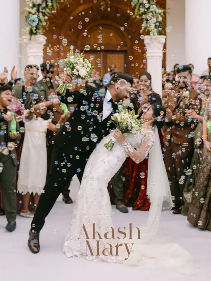 A spectacular dip and kiss as the newlyweds are showered with bubbles. This dynamic and joyful shot is the perfect finale to their church ceremony.