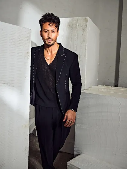 Another angle of this modern suit, showing how it moves. It's a sleek and sophisticated look with a definite edge.