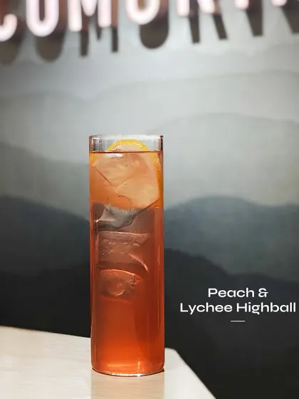 The Peach & Lychee Highball, a fruity and refreshing drink from a limited-edition menu.