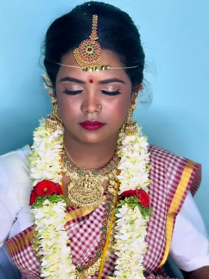 A portrait of my beautiful ebony bride Nithya. Her muhurtham makeup features a classic red lip and soft, glowing skin.