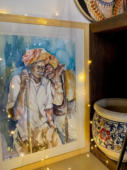 'Gharwali shaam' (An evening at home). This is a view from where I sit, with one of my framed paintings adding to the cozy corner of my home.