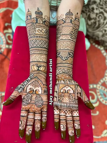 A beautiful design with peacocks on the palms and palace-inspired architecture on the forearms, creating a royal and elegant look.