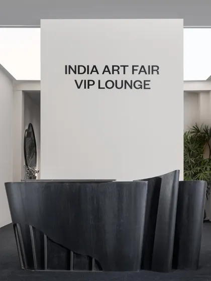 The entrance to the VIP Lounge, featuring a sculptural reception desk we designed for the event. This piece set the tone for the entire space, welcoming guests into an environment of elevated design and artistry.