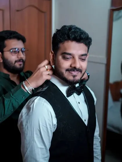 A duplicate of 332, capturing a fun, candid getting-ready moment.