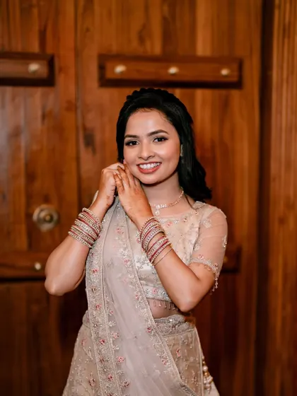 A close-up shot of Minu, showing her beautiful smile and the flawless finish of her engagement makeup.