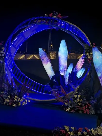 A custom-designed photo booth for the celestial sangeet. Guests could sit inside a moon-shaped ring, surrounded by glowing galaxy crystals, for a truly unique picture.