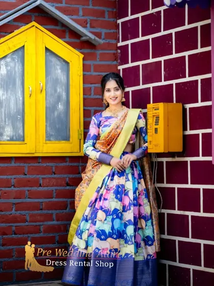 The printed lehenga is posed against a colorful backdrop, enhancing its fun and playful vibe.