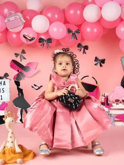 A different take on the fashion theme, this princess is wearing a beautiful satin pink gown.