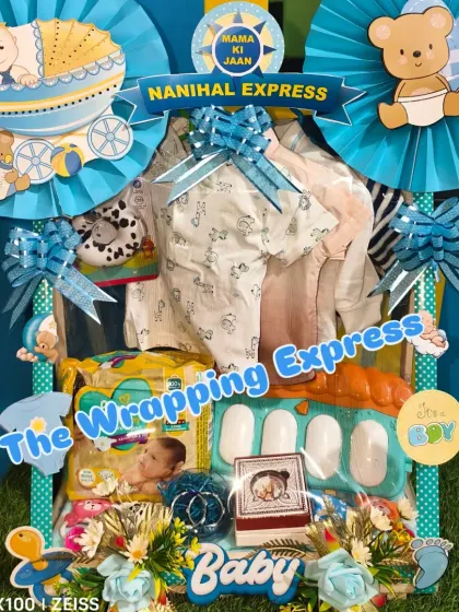 A close-up of the 'Mama ki Jaan' hamper, showing the details of the items packed inside, including a baby piano toy.