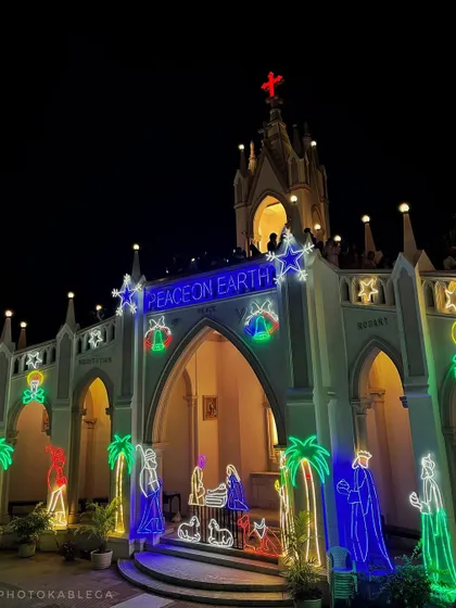 Another perspective of the church entrance, highlighting the neon-style light decorations.