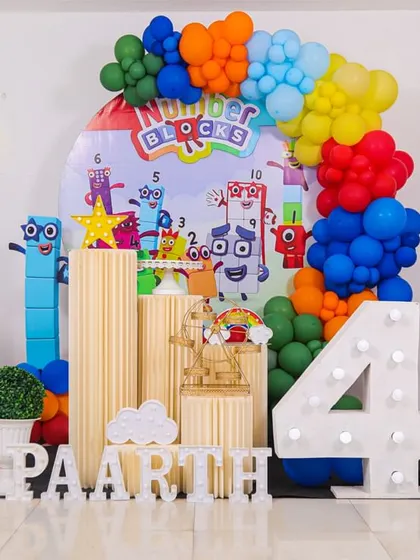 A charming 'Woodland' themed birthday party, with rustic decor, forest animal cutouts, and natural elements, creating a cozy and enchanting setting.