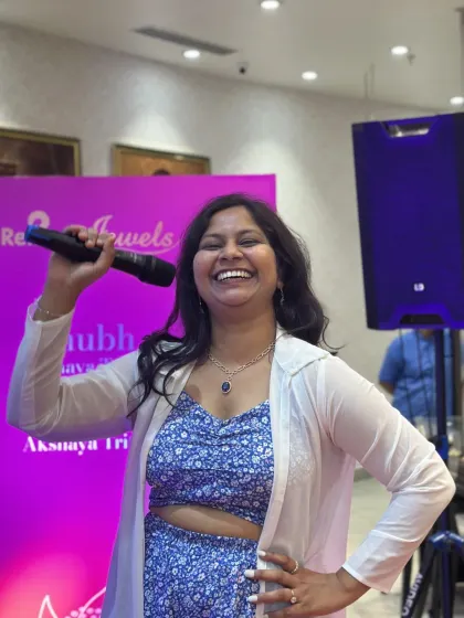 A moment of pure joy while hosting. My passion for my work shines through, creating an infectious energy that spreads to the audience.