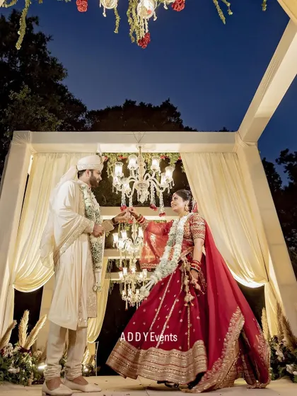 A moment of pure romance under the stars. This couple shares a dance within their beautifully lit mandap, showcasing how our designs create intimate spaces for unforgettable memories.