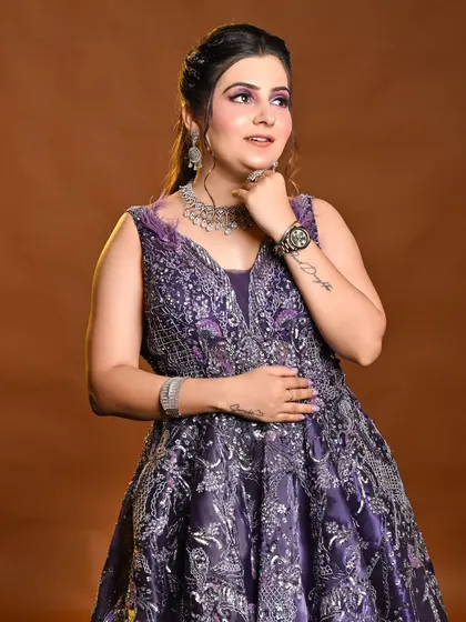 Our client looks stunning in this purple gown, perfect for her engagement photoshoot.