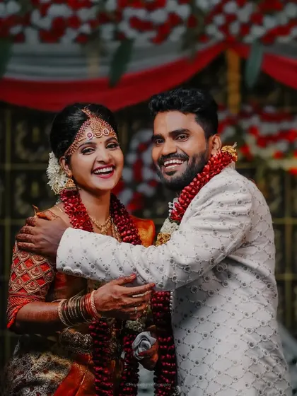 A candid shot capturing the laughter and happiness of a couple during their wedding reception. These are the moments that families will cherish for years to come.