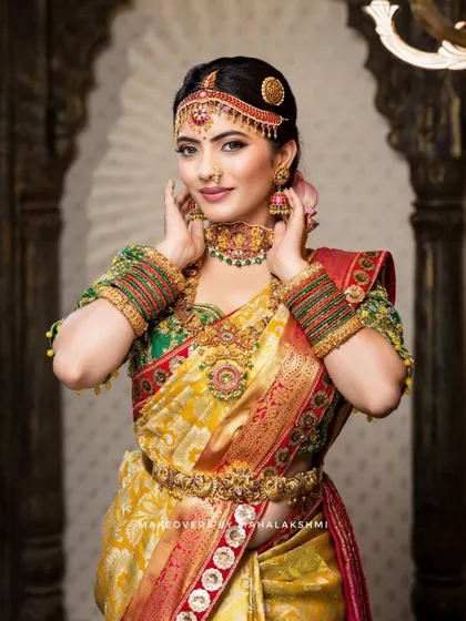 This detailed photoshoot showcases a complete South Indian bridal look, from the intricate matha patti and layered necklaces to the flawless airbrush makeup and traditional saree draping.