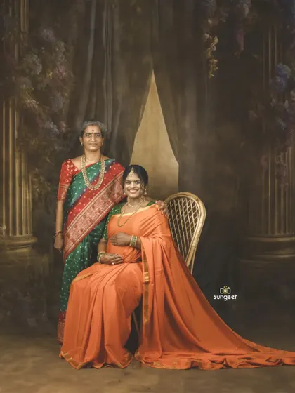 A multi-generational portrait, celebrating the journey of motherhood with both the expecting mother and her own mother. A truly precious memory.