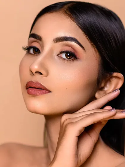 This beauty shot is a perfect example of my clean and polished retouching style. The skin looks flawless yet natural, and the makeup is beautifully defined.
