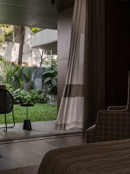 A view from a bedroom in the Pràna house, looking out onto the lush garden. We designed the home so that every room has a beautiful connection to the outdoors.