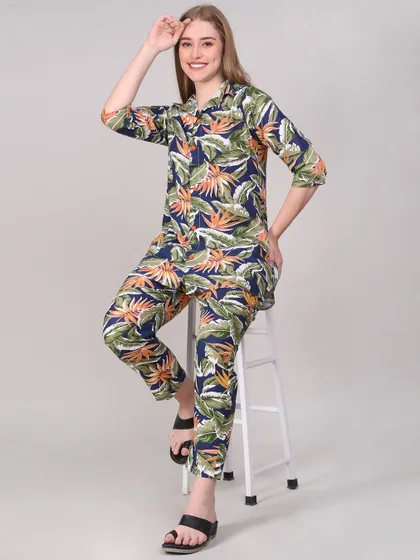 A seated, lifestyle pose in the same loungewear set. This adds variety to the product gallery and shows how the garment looks in a more relaxed posture.