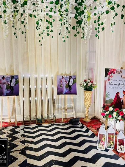 Another view of the personalized walkway, featuring the couple's photos, a custom welcome sign, and elegant lanterns, making the entrance a journey through their story.