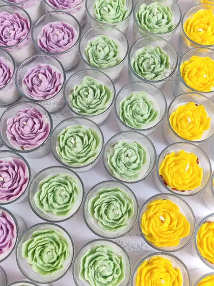 A colorful batch of peony votive jar candles in purple, green, and yellow, made for Meenal's baby shower.