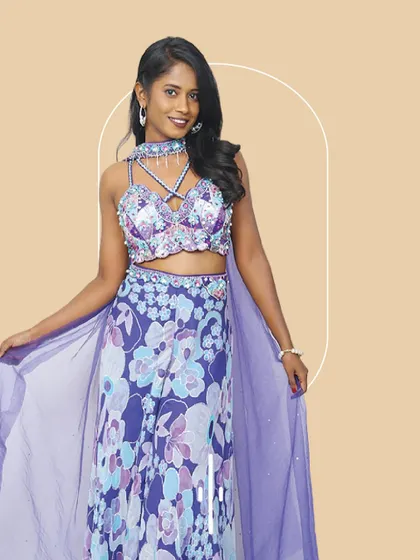 This floral printed co-ord set with a flowing cape is fun and flirty. It's an ideal outfit to rent for a beach wedding or a vibrant mehendi party.