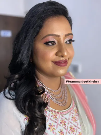 This client looks radiant and ready to celebrate at her brother-in-law's reception.