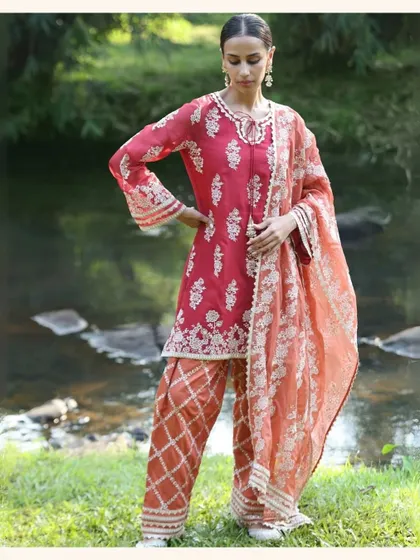 A beautiful red and peach kurta set that's perfect for the festive season. The combination of colors is so fresh and vibrant.