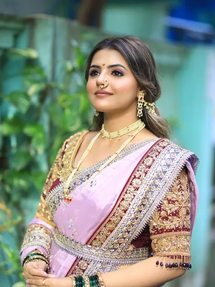 Another angle of the regal lavender Nauvari look, highlighting the traditional jewelry and the bride's serene expression.