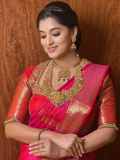 The soft smile and glowing skin are the highlights of this look. My training emphasizes enhancing the client's best features and letting their inner beauty shine through.