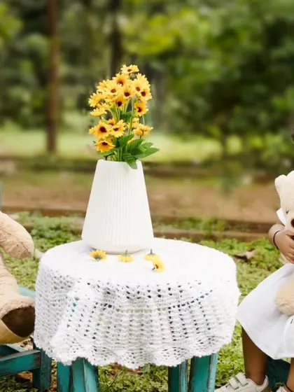 A little girl having a tea party with her teddy bears in the park. These imaginative play scenarios make for wonderful photos.