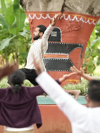 Leading a yoga session in front of a sacred banyan tree.